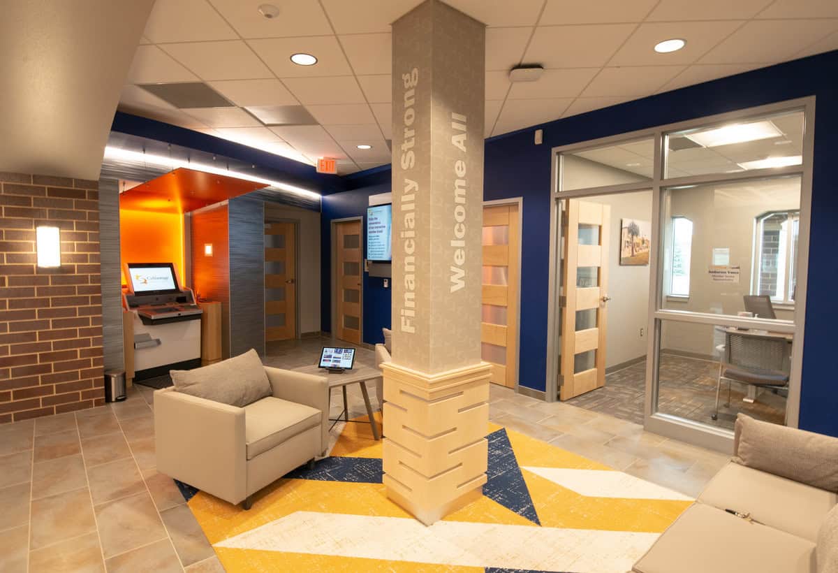 Lobby area with large pillar in the center of the room.