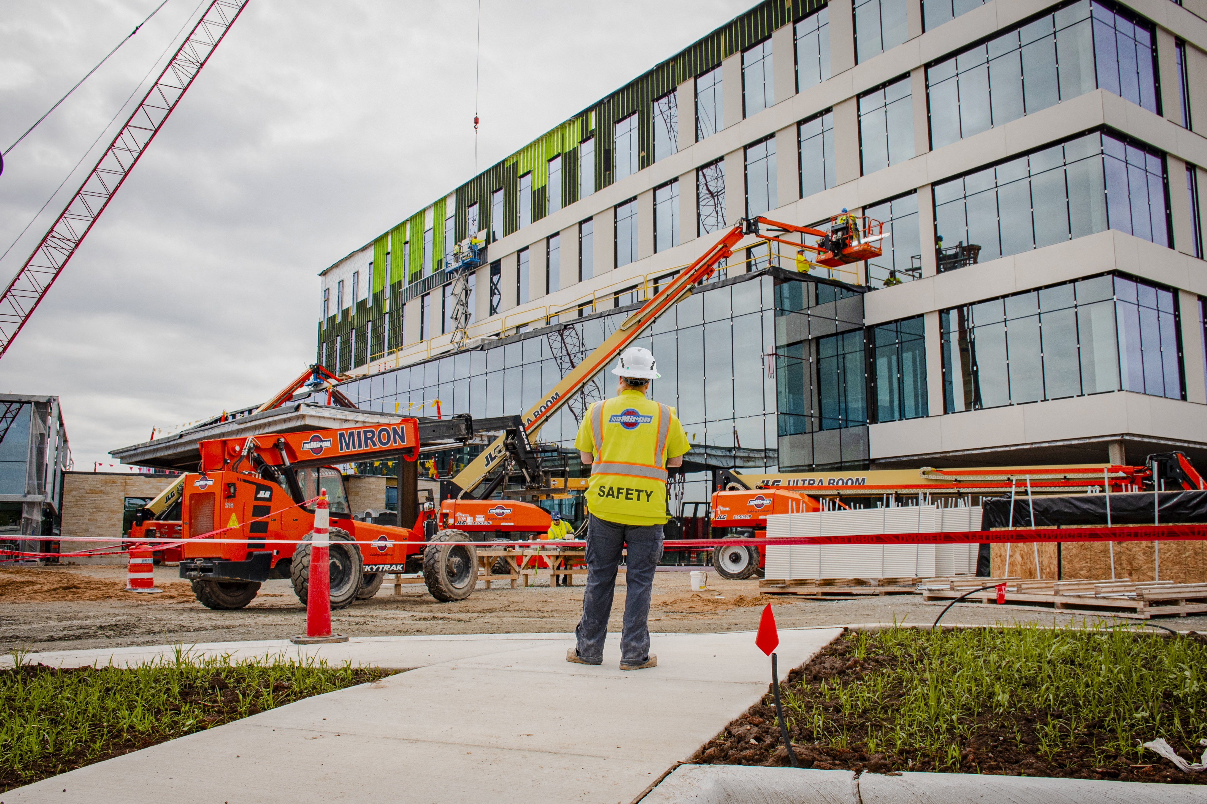 Miron worker in safety gear at a job site