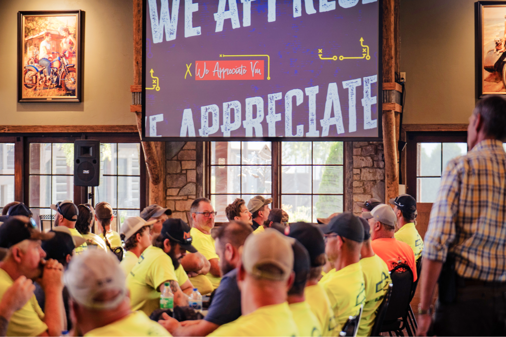 Team members gathered at a recognition event