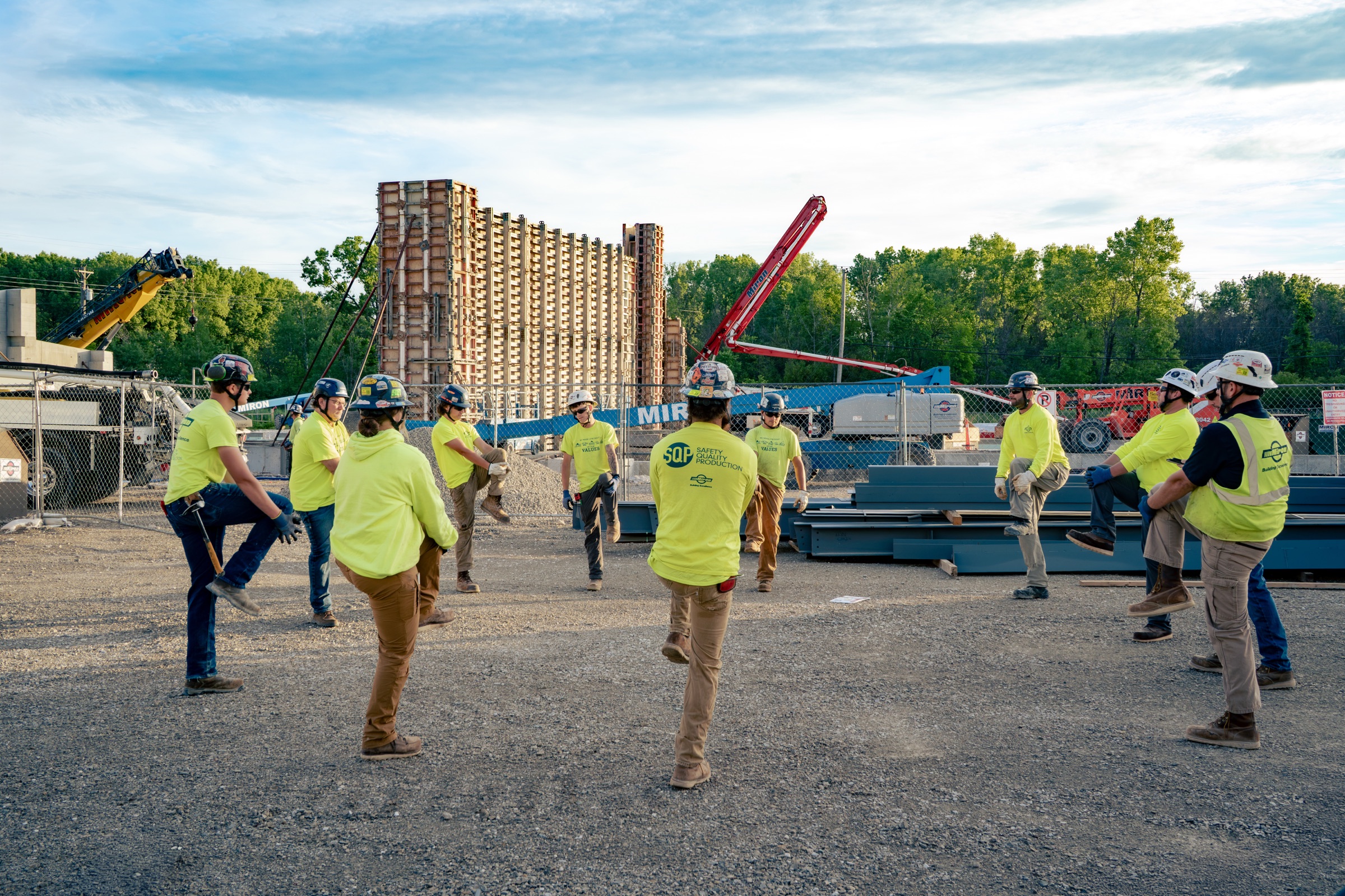 Miron crew doing pre-shift stretches on a jobsite